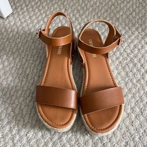Brown platform sandals.